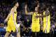 OAKLAND, CALIFORNIA - JANUARY 08: Stephen Curry #30 and Draymond Green #23 of the Golden State Warriors congratulate Klay Thompson #11 of the Golden State Warriors during a time out of their game against the New York Knicks at ORACLE Arena on January 08,