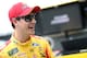 DAYTONA BEACH, FL - FEBRUARY 09: Joey Logano, driver of the #22 Shell Pennzoil Ford, stands in the garage area during practice for the Monster Energy NASCAR Cup Series 61st Annual Daytona 500 at Daytona International Speedway on February 9, 2019 in Dayto
