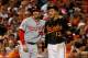 BALTIMORE, MD - JULY 10: Bryce Harper # 34 of the Washington Nationals and Manny Machado # 13 of the Baltimore Orioles speak during their game at Oriole Park at Camden Yards on July 10, 2015 in Baltimore, Maryland. (Photo by Rob Carr / Getty Images)