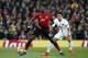 MANCHESTER, ENGLAND - FEBRUARY 12: Paul Pogba of Manchester United, Marquinhos of PSG during the UEFA Champions League Round of 16 First Leg match between Manchester United (Man U) and Paris Saint-Germain (PSG) at Old Trafford stadium on February 12, 2019