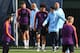 Manchester City's English defender Kyle Walker (2L), Manchester City's Spanish manager Pep Guardiola (C), Manchester City's German midfielder Leroy Sane (centre R), and Spanish assitant coach Mikel Arteta (3R) attend a training session at City Football Ac