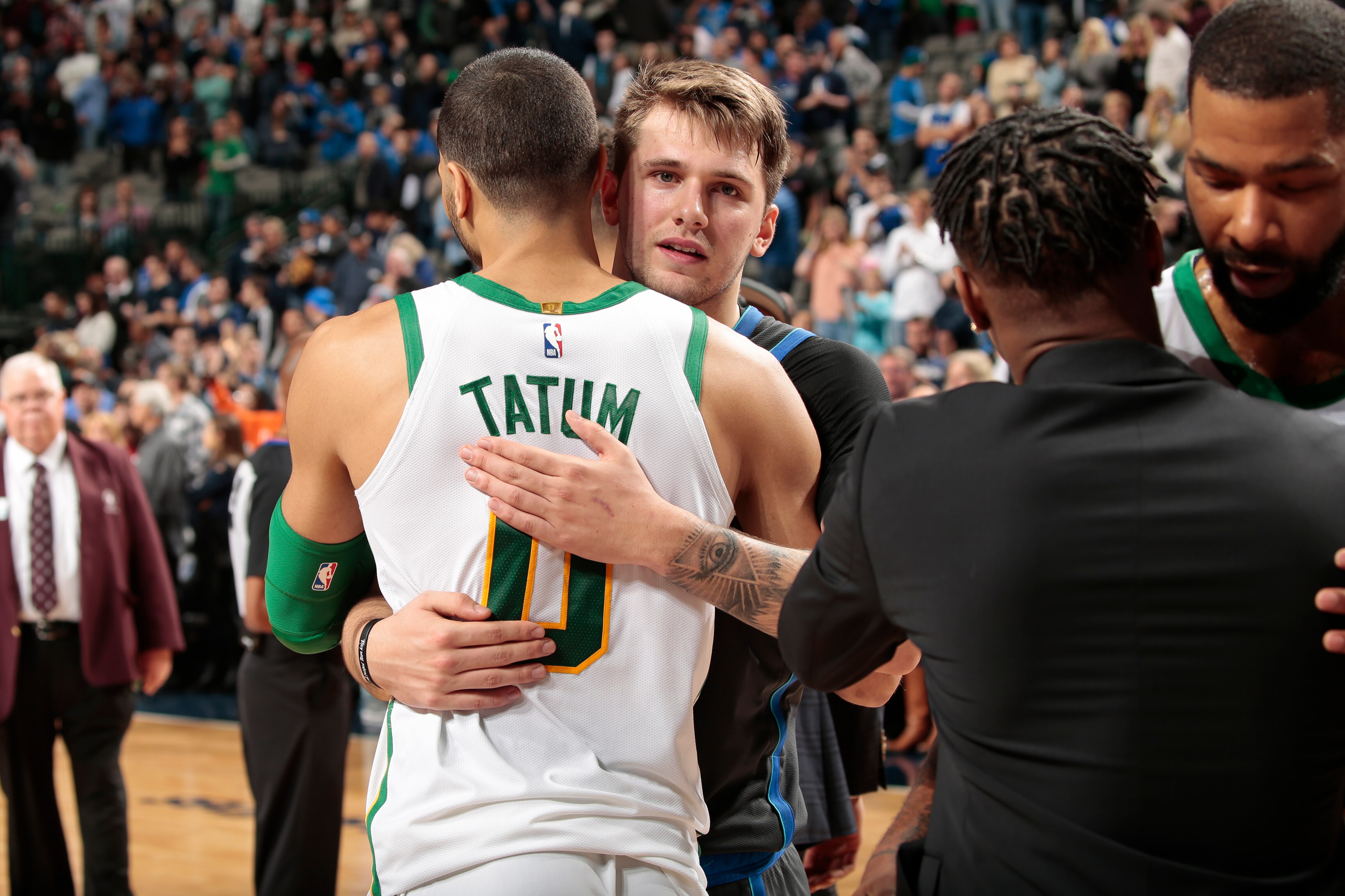 DALLAS, TX - NOVEMBER 24: Jayson Tatum #0 of the Boston Celtics and Luka Doncic #77 of the Dallas Mavericks hug after the game on November 24, 2018 at the American Airlines Center in Dallas, Texas. NOTE TO USER: User expressly acknowledges and agrees that