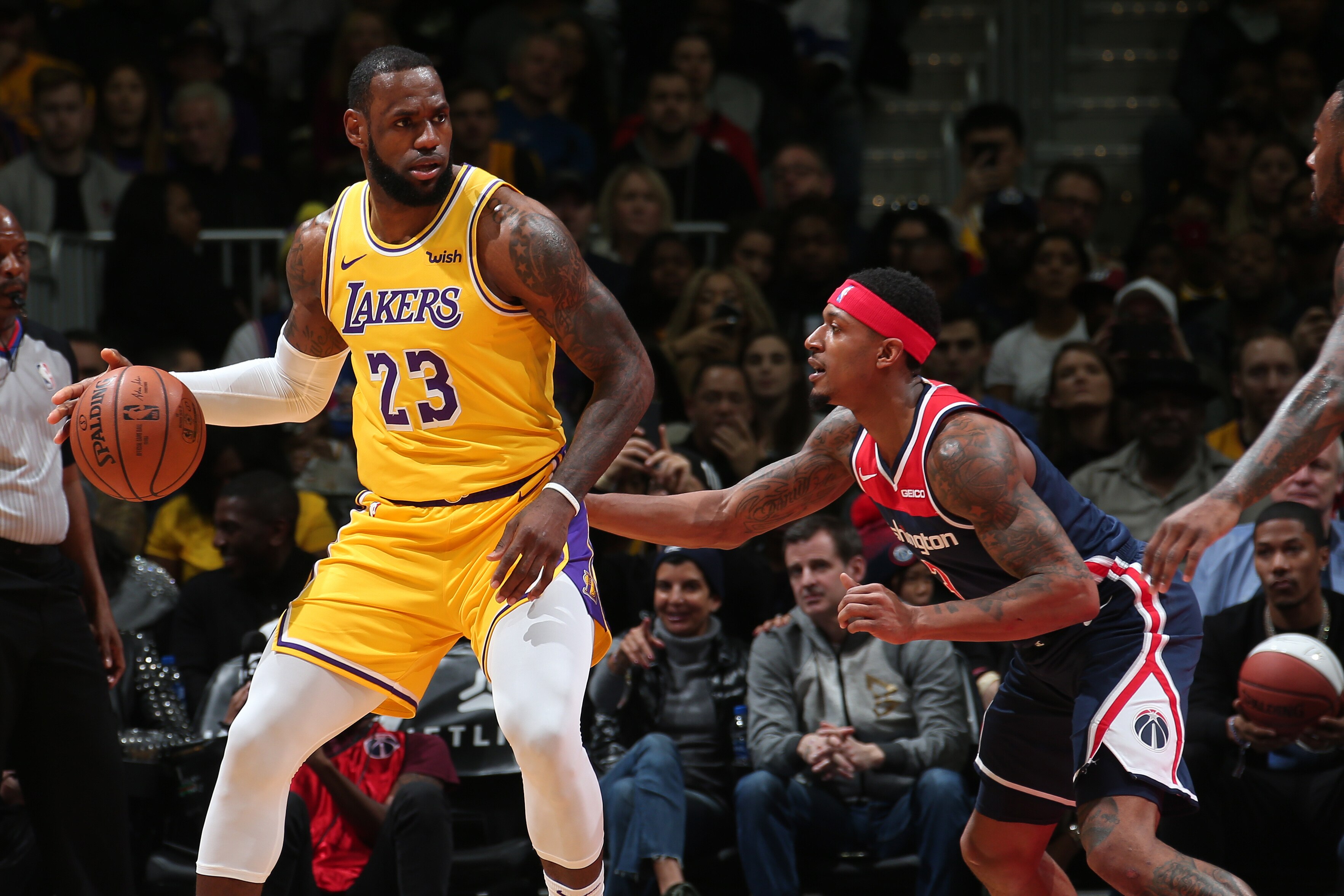 WASHINGTON, DC -  DECEMBER 16: LeBron James #23 of the Los Angeles Lakers handles the ball against Bradley Beal #3 of the Washington Wizards on December 16, 2018 at Capital One Arena in Washington, DC. NOTE TO USER: User expressly acknowledges and agrees 