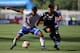 Paraguay's Marcelo Rolon (L) vies for the ball with Argentina's Thiago Almada (R) during their South American U-20 football match at La Granja stadium in Curico, Chile, on January 20, 2019. (Photo by CLAUDIO REYES / AFP) (Photo credit should read C