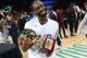 CHARLOTTE, NC - FEBRUARY 15: Famous Los #32 holds the MVP trophy after the 2019 NBA All-Star Celebrity Game on February 15, 2019 at Bojangles Coliseum in Charlotte, North Carolina. NOTE TO USER: User expressly acknowledges and agrees that, by downloading