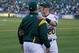 A's infielder Mark Canha made a public show of his support for Maxwell's protest by standing next to him while Maxwell kneeled before the game in 2017.