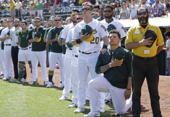 Bruce Maxwell, seen here kneeling before an A's-Rangers game late in the 2017 season, is still the only player in Major League Baseball to have kneeled while protesting against social injustice.