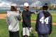 Maxwell, pictured in the white cap, spent some time this February helping disabled young people learn how to play baseball.