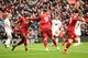 LIVERPOOL, ENGLAND - MARCH 10: Roberto Firmino of Liverpool celebrates with Sadio Mane of Liverpool after scoring his sides first goal during the Premier League match between Liverpool FC and Burnley FC at Anfield on March 10, 2019 in Liverpool, United Ki