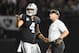 OAKLAND, CA - SEPTEMBER 10: Derek Carr #4 of the Oakland Raiders speaks with head coach Jon Gruden in the first quarter during their NFL game against the Los Angeles Rams at Oakland-Alameda County Coliseum on September 10, 2018 in Oakland, California. (