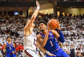 LUBBOCK, TX - FEBRUARY 23: Dedric Lawson #1 of the Kansas Jayhawks goes to the basket against Matt Mooney #13 of the Texas Tech Red Raiders during the game on February 23, 2019 at United Supermarkets Arena in Lubbock, Texas. Texas Tech defeated Kansas 91-