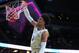 LAS VEGAS, NEVADA - MARCH 14: Matisse Thybulle #4 of the Washington Huskies dunks the ball against the USC Trojans in the 2nd half during a quarterfinal game of the Pac-12 basketball tournament at T-Mobile Arena on March 14, 2019 in Las Vegas, Nevada. (Ph