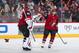 GLENDALE, ARIZONA - MARCH 14: Goaltender Darcy Kuemper #35 and Vinnie Hinostroza #13 of the Arizona Coyotes celebrate after Hinostroza scored a hat-trick goal against the Anaheim Ducks during the third period of the NHL game at Gila River Arena on March