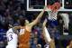 KANSAS CITY, MISSOURI - MARCH 14: Jericho Sims #20 of the Texas Longhorns dunks as K.J. Lawson #13 of the Kansas Jayhawks defends during the quarterfinal game of the Big 12 Basketball Tournament at Sprint Center on March 14, 2019 in Kansas City, Missouri