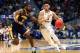HARTFORD, CONNECTICUT - MARCH 21: Markus Howard #0 of the Marquette Golden Eagles drives the ball past Shaq Buchanan #11 of the Murray State Racers during the first round game of the 2019 NCAA Men's Basketball Tournament at XL Center on March 21, 2019 in