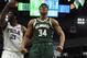 MILWAUKEE, WISCONSIN - MARCH 17: Giannis Antetokounmpo #34 of the Milwaukee Bucks reacts to a dunk over Ben Simmons #25 of the Philadelphia 76ers during the second half of a game at Fiserv Forum on March 17, 2019 in Milwaukee, Wisconsin. NOTE TO USER: Us