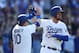 LOS ANGELES, CALIFORNIA - MARCH 31: Justin Turner #10 and Cody Bellinger #35 of the Los Angeles Dodgers celebrate scoring against the Arizona Diamondbacks during the eighth inning at Dodger Stadium on March 31, 2019 in Los Angeles, California. (Photo by Y