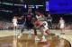 MINNEAPOLIS, MINNESOTA - APRIL 06: De'Andre Hunter #12 of the Virginia Cavaliers dribbles against Horace Spencer #0 of the Auburn Tigers in the first half during the 2019 NCAA Final Four semifinal at U.S. Bank Stadium on April 6, 2019 in Minneapolis, Minn