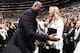 LOS ANGELES, CA - MARCH 11: Magic Johnson and Jeanie Buss exchange a hug during the game between the Los Angeles Lakers and Cleveland Cavaliers on March 11, 2018 at STAPLES Center in Los Angeles, California. NOTE TO USER: User expressly acknowledges and
