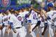 CHICAGO, ILLINOIS - APRIL 08: Javier Baez #9 of the Chicago Cubs greets teammates during player introductions before the home opening game against the Pittsburgh Pirates at Wrigley Field on April 08, 2019 in Chicago, Illinois. The Cubs defeated the Pirate