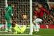 Manchester United's Spanish goalkeeper David de Gea (L) looks on as a shot from Barcelona's Uruguayan forward Luis Suarez strikes Manchester United's English defender Luke Shaw (2R) and is awarded as an own goal during the UEFA Champions league first leg