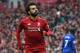 Liverpool's Egyptian midfielder Mohamed Salah celebrates after scoring their second goal during the English Premier League football match between Liverpool and Chelsea at Anfield in Liverpool, north west England on April 14, 2019. (Photo by Paul ELLIS / A