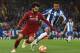 Liverpool's Egyptian midfielder Mohamed Salah (L) vies with Porto's Brazilian defender Eder Militao (R) during the UEFA Champions League quarter-final, first leg football match between Liverpool and FC Porto at Anfield stadium in Liverpool, north-west Eng