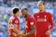 CARDIFF, WALES - APRIL 21: Georginio Wijnaldum of Liverpool (front) celebrates as he scores his team's first goal during the Premier League match between Cardiff City and Liverpool FC at Cardiff City Stadium on April 21, 2019 in Cardiff, United Kingdom.