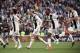(From L) Juventus' Colombian midfielder Juan Cuadrado, Juventus' Portuguese forward Cristiano Ronaldo, Juventus' French midfielder Blaise Matuidi and Juventus' German midfielder Emre Can celebrate after Juventus secured its 8th consecutive Italian 2018/19
