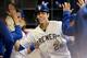 MILWAUKEE, WISCONSIN - APRIL 20: Christian Yelich #22 of the Milwaukee Brewers celebrates with teammates after hitting a home run in the sixth inning against the Los Angeles Dodgers at Miller Park on April 20, 2019 in Milwaukee, Wisconsin. (Photo by Dyla