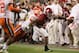 SANTA CLARA, CA - JANUARY 07: Josh Jacobs #8 of the Alabama Crimson Tide is wrapped up by Tre Lamar #57 of the Clemson Tigers Tidein the CFP National Championship presented by AT&T at Levi's Stadium on January 7, 2019 in Santa Clara, California. (Photo
