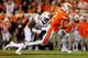STILLWATER, OK - OCTOBER 27: Wide receiver Tylan Wallace #2 of the Oklahoma State Cowboys takes a catch for 23 yards against linebacker Gary Johnson #33 of the Texas Longhorns in the second quarter on October 27, 2018 at Boone Pickens Stadium in Stillwat