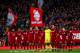 LIVERPOOL, ENGLAND - APRIL 26: Players of Liverpool pay their respects to the late Tommy Smith during the Premier League match between Liverpool FC and Huddersfield Town at Anfield on April 26, 2019 in Liverpool, United Kingdom. (Photo by Robbie Jay Barra