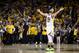 OAKLAND, CALIFORNIA - MAY 08: Stephen Curry #30 of the Golden State Warriors reacts after Klay Thompson #11 made the clinching basket with four seconds left of their game against the Houston Rockets during Game Five of the Western Conference Semifinals