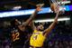 Brandon Ingram driving on Deandre Ayton.