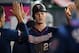 ANAHEIM, CA - MAY 21: Max Kepler #26 of the Minnesota Twins congratulated after being driven in on a double by Jorge Polanco #11 in the sixth inning against the Los Angeles Angels of Anaheim at Angel Stadium of Anaheim on May 21, 2019 in Anaheim, Californ