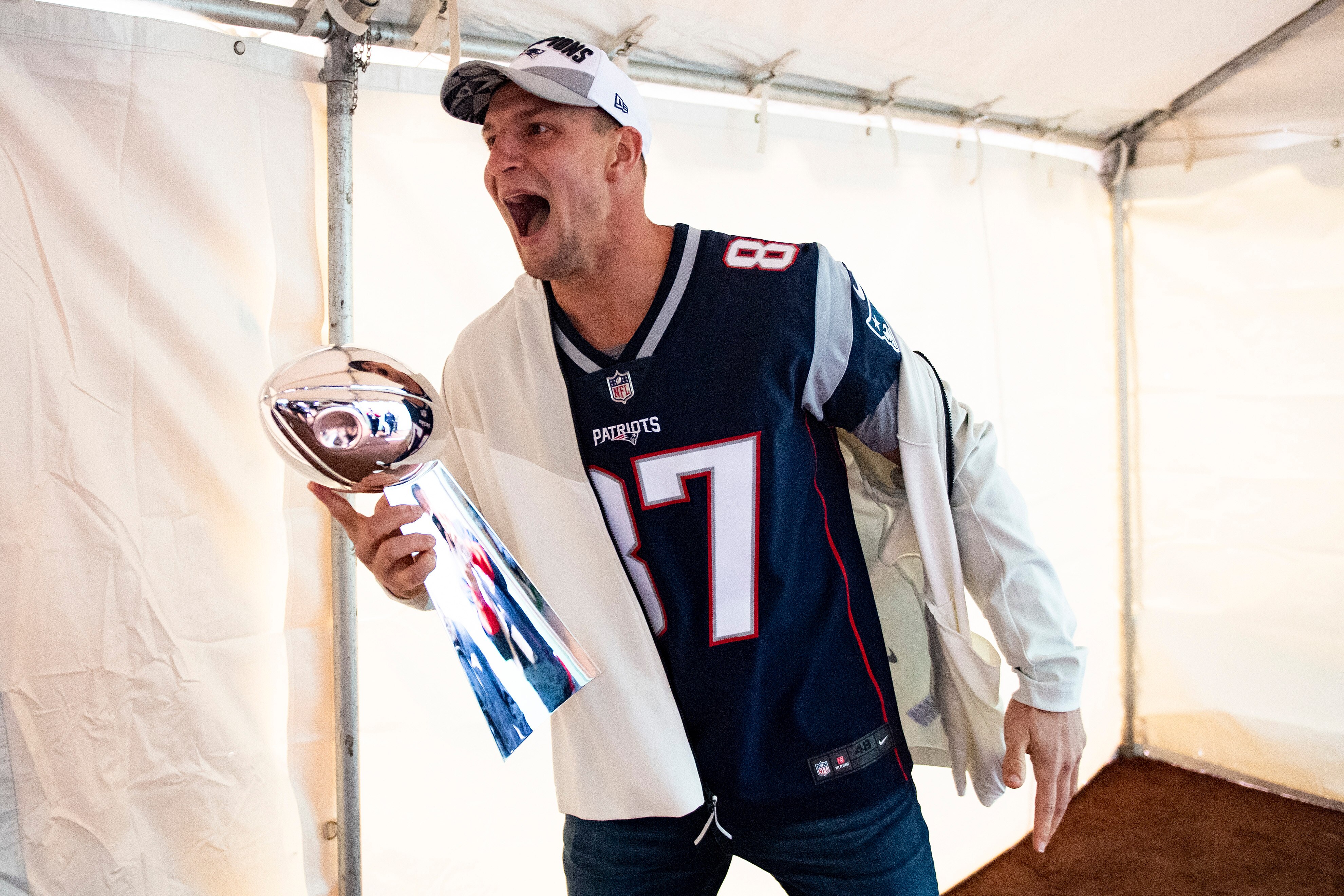 BOSTON, MA - APRIL 9: Rob Gronkowski of the New England Patriots reacts with the Vince Lombardi trophy during the Boston Red Sox 2018 World Series championship ring ceremony before the Opening Day game against the Toronto Blue Jays on April 9, 2019 at Fen