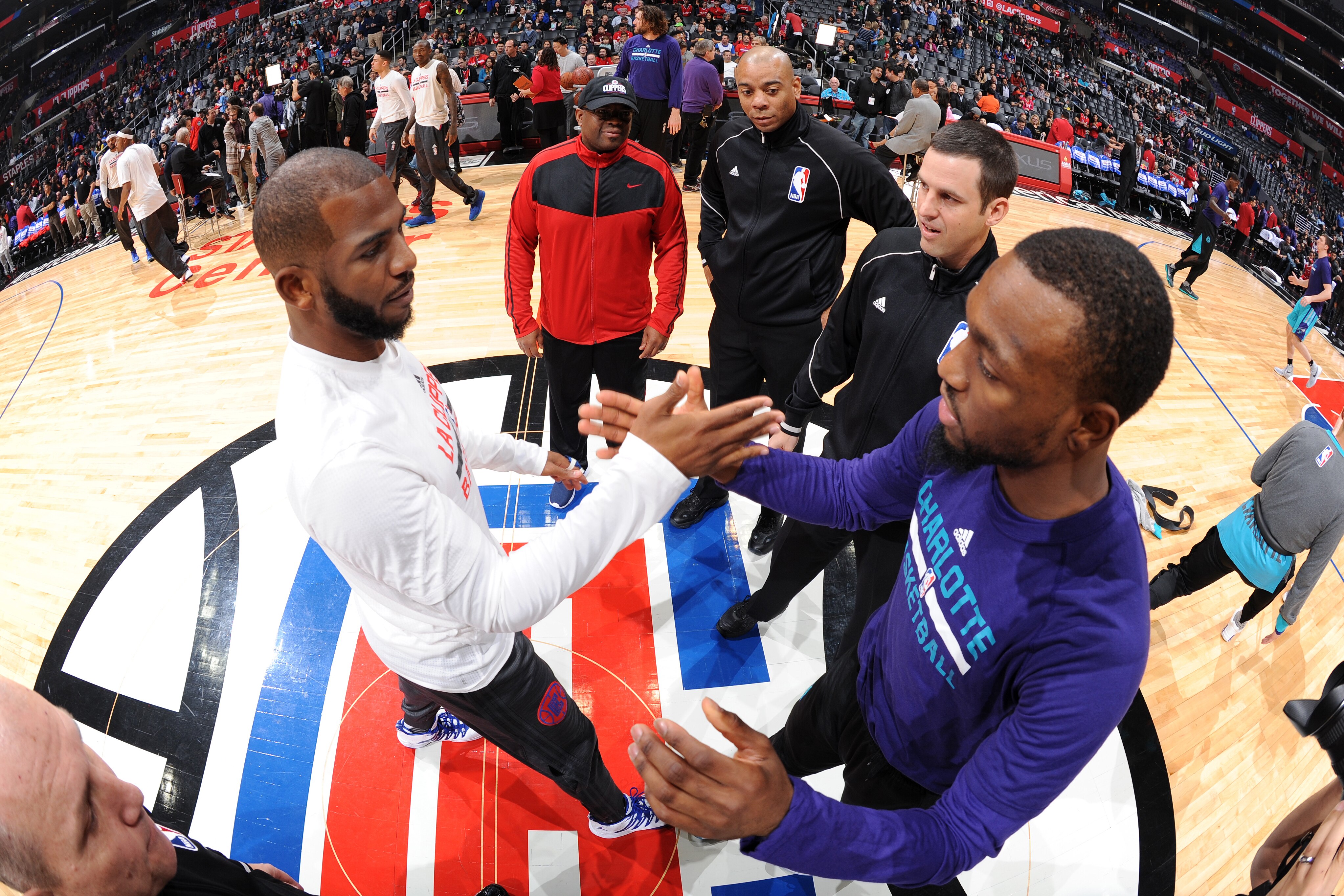 LOS ANGELES, CA - JANUARY 9: Chris Paul #3 of the Los Angeles Clippers and Kemba Walker #15 of the Charlotte Hornets shake hands before the game on January 9, 2016 at STAPLES Center in Los Angeles, California. NOTE TO USER: User expressly acknowledges and