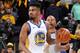 OAKLAND, CA - JUNE 5: Jacob Evans #10 of the Golden State Warriors handles the ball against the Toronto Raptors during Game Three of the NBA Finals on June 5, 2019 at ORACLE Arena in Oakland, California. NOTE TO USER: User expressly acknowledges and agree