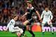 Real Madrid's Croatian midfielder Luka Modric (L) challenges Ajax's Dutch midfielder Frenkie de Jong during the UEFA Champions League round of 16 second leg football match between Real Madrid CF and Ajax at the Santiago Bernabeu stadium in Madrid on March