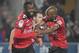 Guingamp's French forward Marcus Thuram (L) celebrates with teammates after scoring a goal during the French L1 football match between Racing Club Strasbourg Alsace and En Avant Guingamp at the Meinau stadium in Strasbourg, eastern France on April 13, 201