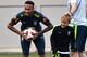 Brazil's forward Neymar (L) smiles past his son Davi Lucca during a training session at Yug Sport Stadium, in Sochi, on July 4, 2018, during the Russia 2018 World Cup football tournament. (Photo by NELSON ALMEIDA / AFP) (Photo credit should read NE