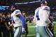 ARLINGTON, TEXAS - JANUARY 05: Ezekiel Elliott #21 and Dak Prescott #4 of the Dallas Cowboys a win against the Seahawks 24-22 in the Wild Card Round at AT&T Stadium on January 05, 2019 in Arlington, Texas. (Photo by Ronald Martinez/Getty Images)