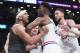 Jimmy Butler tangled up with Nets veteran Jared Dudley.