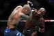 LAS VEGAS, NEVADA - MARCH 02: Jon Jones (R) and Anthony Smith trade punches during their light heavyweight title bout during UFC 235 at T-Mobile Arena on March 02, 2019 in Las Vegas, Nevada. Jones won by unanimous decision. (Photo by Isaac Brekken/Getty