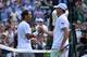 Spain's Rafael Nadal shakes hands with US player Sam Querrey during their men's singles quarter-final match on day nine of the 2019 Wimbledon Championships at The All England Lawn Tennis Club in Wimbledon, southwest London, on July 10, 2019. (Photo by Ben