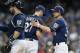 MILWAUKEE, WISCONSIN - JUNE 30: Zach Davies #27 of the Milwaukee Brewers hands to game ball to Craig Counsell #30 of the Milwaukee Brewers after being relieved of pitching against the Pittsburgh Pirates at Miller Park on June 30, 2019 in Milwaukee, Wiscon