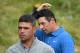 Northern Ireland's Rory McIlroy (R) walks off the 18th green during the first round of the British Open golf Championships at Royal Portrush golf club in Northern Ireland on July 18, 2019. (Photo by Glyn KIRK / AFP) / RESTRICTED TO EDITORIAL USE (P