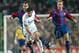 BARCELONA, SPAIN: Portuguese Real Madrid's Luis Figo (C) vies betwen Bacelona's players Gabri (L) and Gaizka Mendieta (R) during their Spanish League match, Barcelona vs. Real Madrid, in Camp Nou Stadium in Barcelona, 23 November 2002. The match ended d