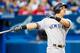 TORONTO, ONTARIO - AUGUST 8: Mike Tauchman #39 of the New York Yankees hits a home run against the Toronto Blue Jays in the third inning during their MLB game at the Rogers Centre on August 8, 2019 in Toronto, Canada. (Photo by Mark Blinch/Getty Images)